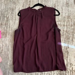 Burgundy blouse with frilly detail on neckline